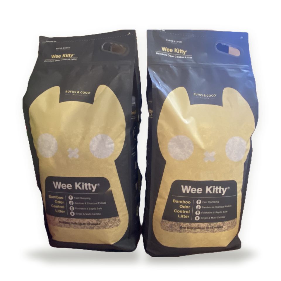 Two bags of Wee Kitty bamboo cat litter by Rufus & Coco