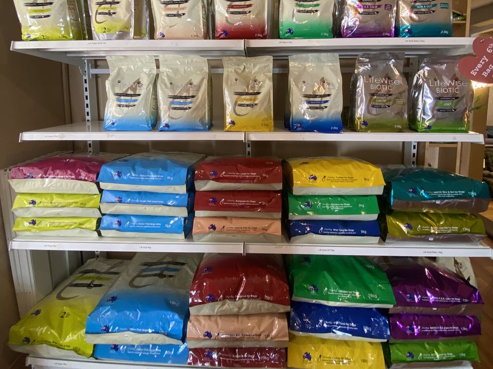 Shelves of LifeWise dry dog food bags at For Pets Sake